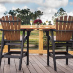 two high-top chairs overlooking the intracoastal waterway with table holding two beverages and flowers at Best Western Plus Myrtle Beach@Intracoasta